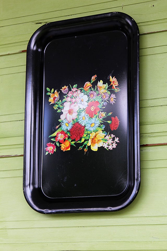 Black tray as part of vintage spring front porch decor