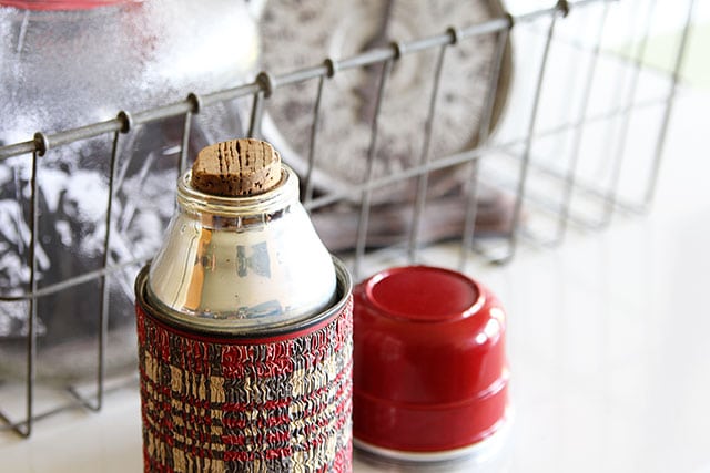 Vintage plaid Aladdin thermos with a cork stopper
