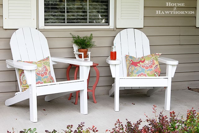 Adirondack chairs on a fun summer porch with a bit of vintage decor