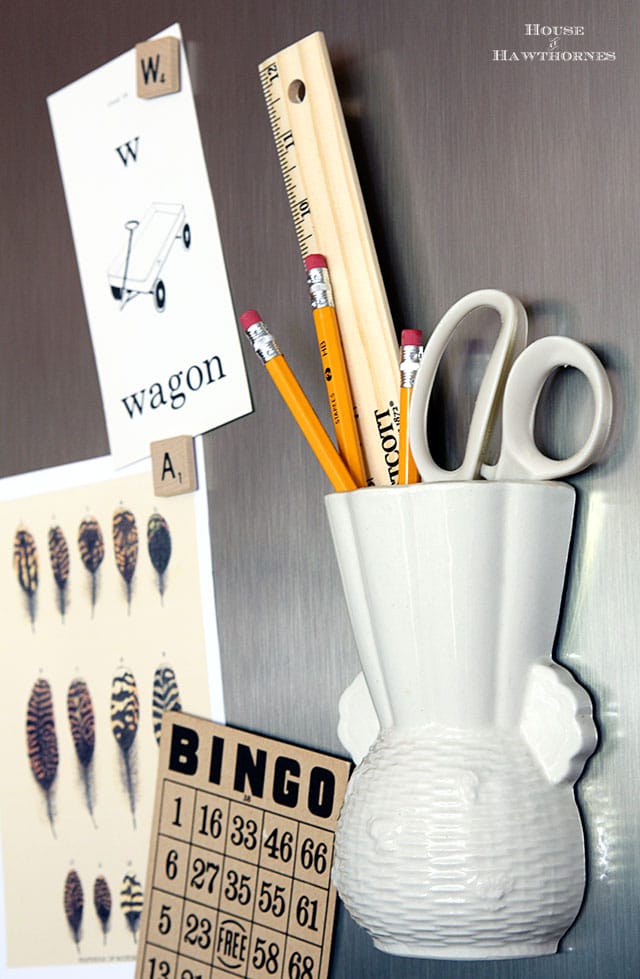Vintage wall pocket used as a wall pocket organizer for the kitchen