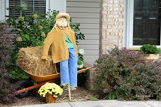 DIY scarecrow for fall decor. Used an inexpensive JoAnn Fabrics' stick scarecrow and dolled her up! via houseofhawthornes.com