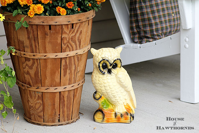 Vintage owl statue used as part of fall porch decorations