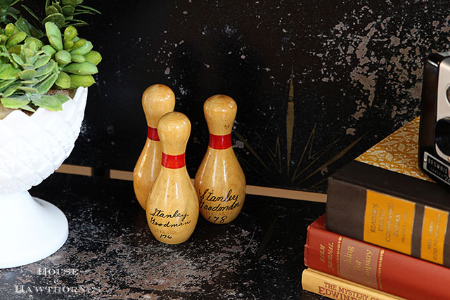 Mini bowling pins in an eclectic vintage entryway via houseofhawthornes.com