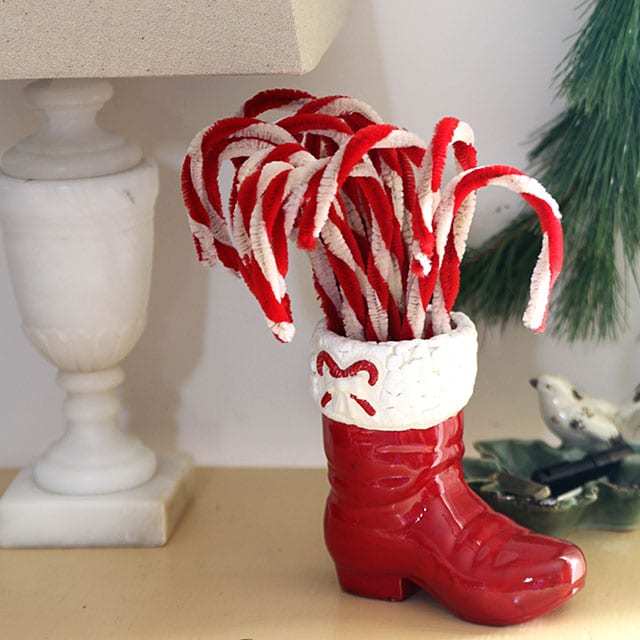 Chenille pipe cleaner candy canes in a vintage Santa boot.