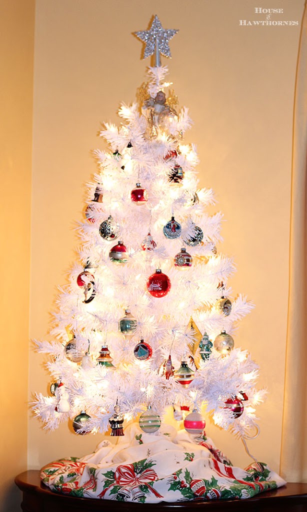 A white Christmas tree with vintage Shiny Brite ornaments creates a modern retro holiday look that fits in with any home decor style for the holiday season!