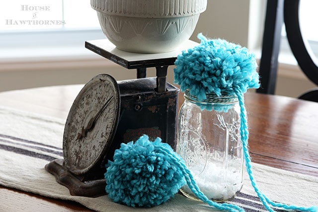 DIY pom poms in a glass jar - for those that don't want to make enough of them for an entire Anthropologie inspired tufted wool wreath. DIY pom poms in a glass jar - for those that don't want to make enough of them for an entire Anthropologie inspired tufted wool wreath.