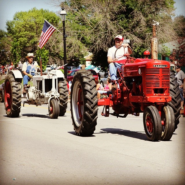 Tractors in a Midwestern 4th of July parade