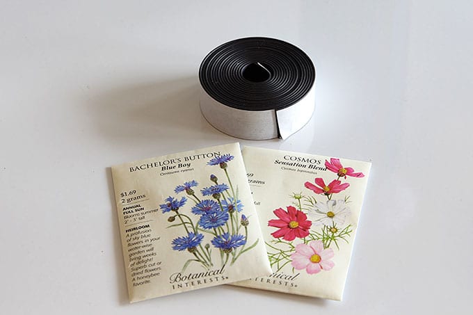 Supplies for seed packet decor idea - seed packets and magnetic tape.