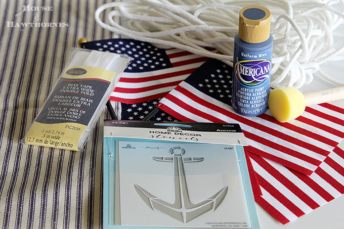 A super easy DIY patriotic banner tutorial. Anchors, flags and sailboats combine for a nautical Fourth Of July home decor style or any patriotic holiday.