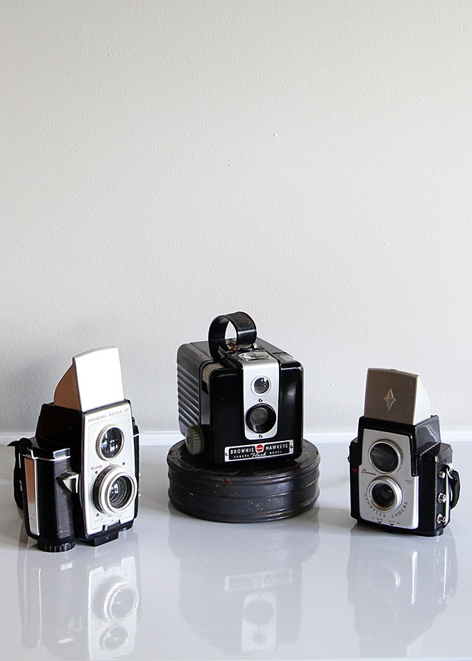 Fall thrifting finds including Thermoses, vintage Shiny Brites, vintage Brownie cameras and a green McCoy planter.