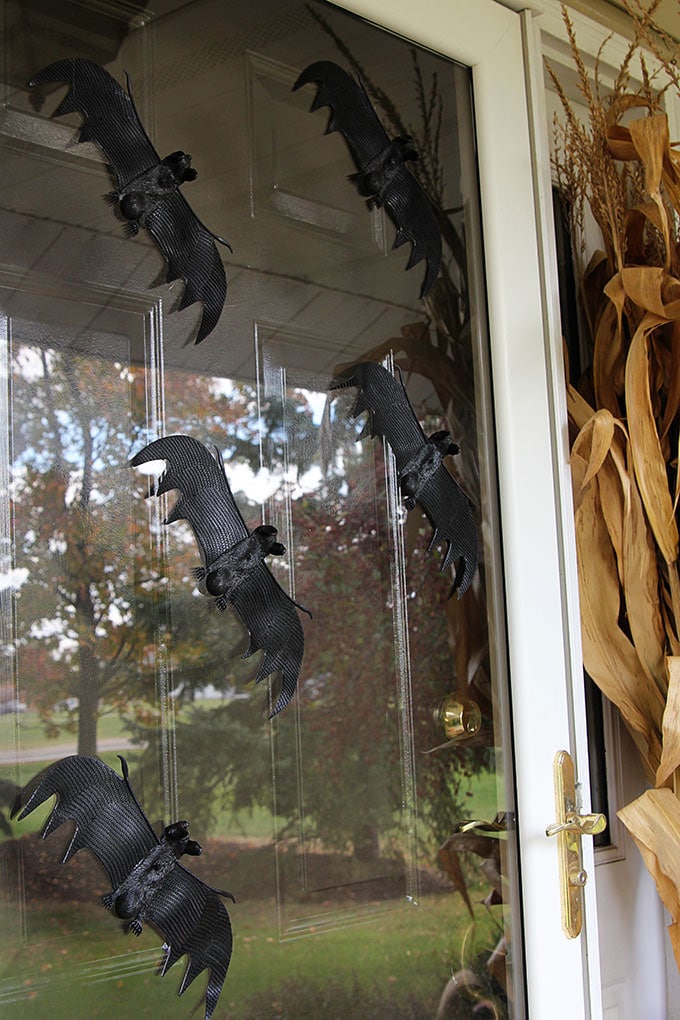 Quick and easy Halloween decorating ideas for your porch. An inexpensive way to transition the porch from fall to Halloween decor with just a few additions. 
