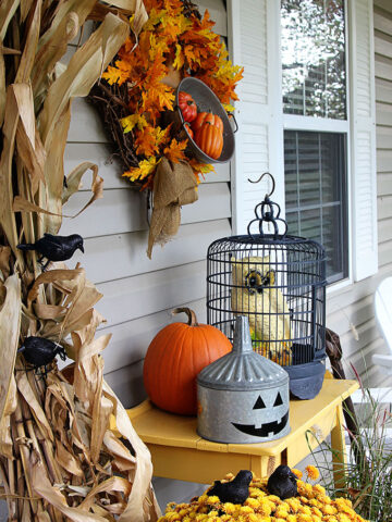 Quick and easy Halloween decorating ideas for your porch. An inexpensive way to transition the porch from fall to Halloween decor with just a few additions.