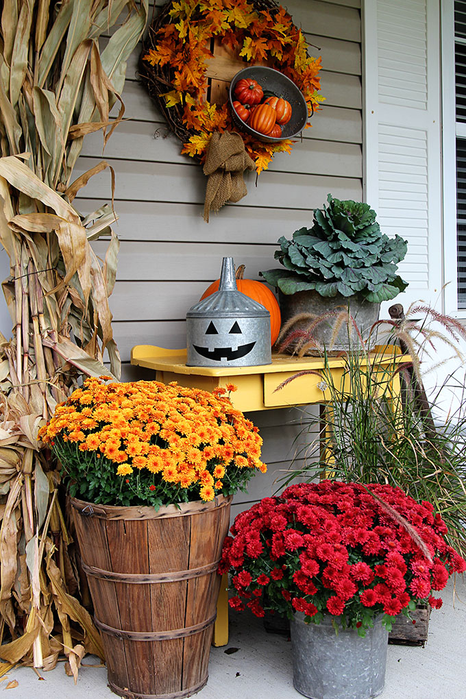 A super cute repurposed Jack-o-Lantern for Halloween made from a galvanized funnel. A quick and easy DIY project for fall!