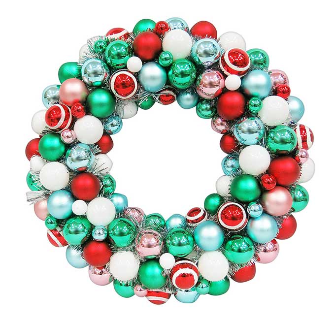 Vintage Christmas ornament wreath with green, red and silver ornaments.