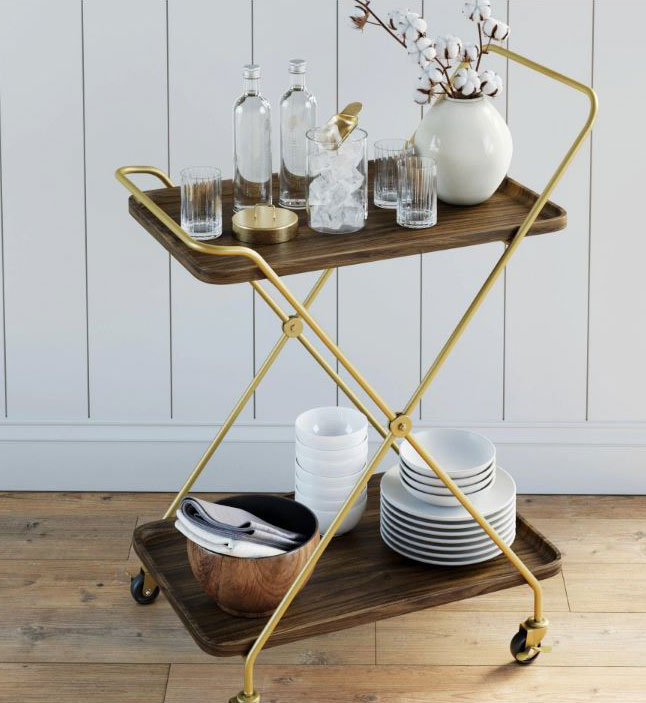 Vintage style rolling metal bar cart with gold legs and wood grained trays.