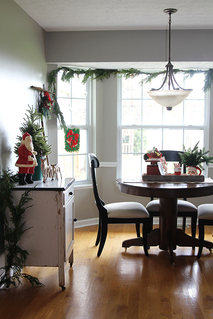 This nostalgic Christmas breakfast room is a great example of how to use vintage Christmas decor in your home without it looking like your grandma's house!