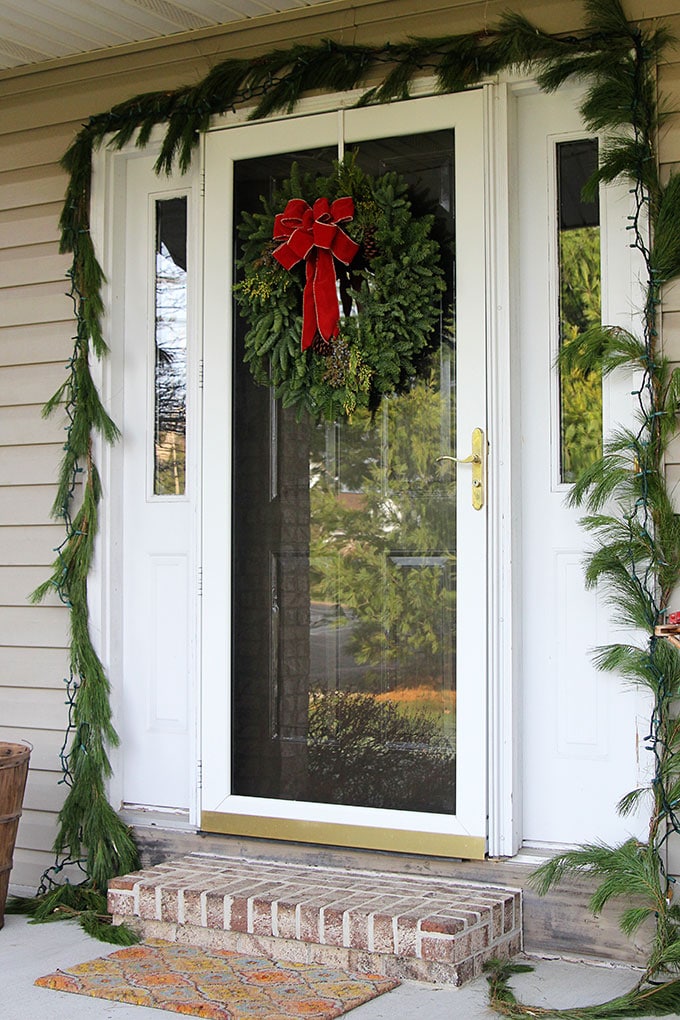 Traditional Christmas porch decor meets FUN and FUNKY! Just because you like a little red and green in your holiday decor doesn't mean it has to be boring.