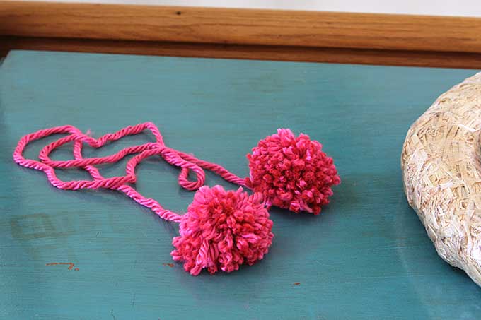 Learn how to make this quick and easy sweater wreath for Valentine's Day. Great way to upcycle your thrift store find. 