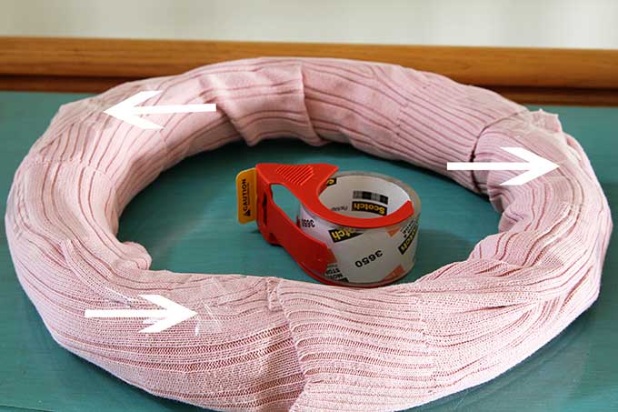 Learn how to make this quick and easy sweater wreath for Valentine's Day. Great way to upcycle your thrift store find. 