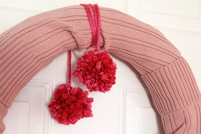 Learn how to make this quick and easy sweater wreath for Valentine's Day. Great way to upcycle your thrift store find.