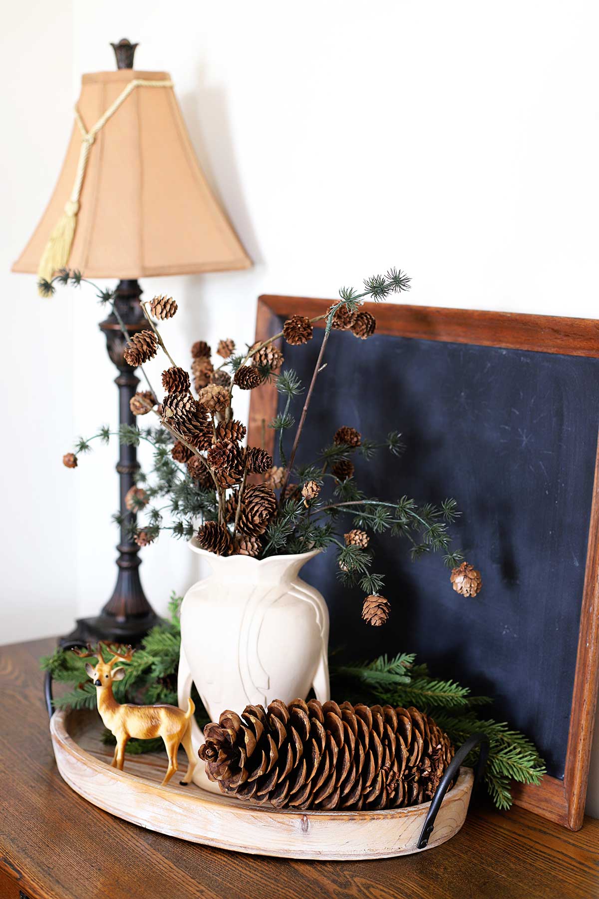 Keeping It Cozy: A Porch for Winter  Pine cone decorations, Front porch  decorating, Winter decor