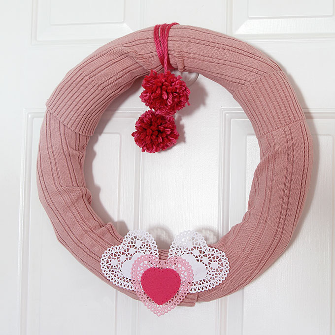 Learn how to make this quick and easy sweater wreath for Valentine's Day. Great way to upcycle your thrift store find.