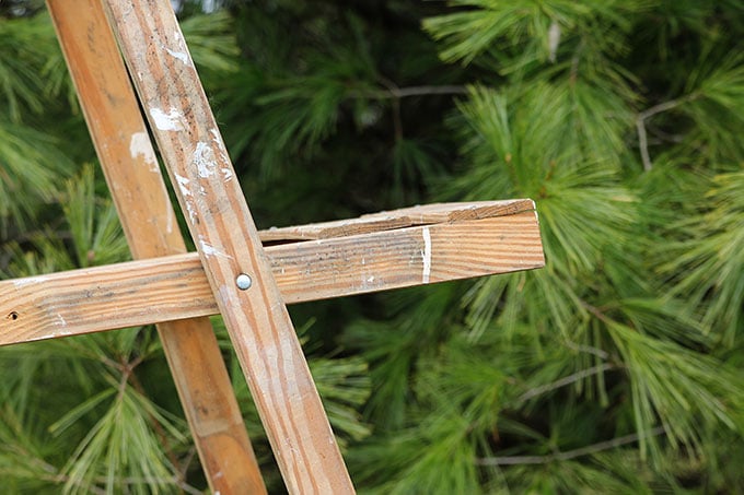 Use a wooden ladder as garden art in the flower beds this summer. They add much needed height to the garden and a place to display bird houses and planters.