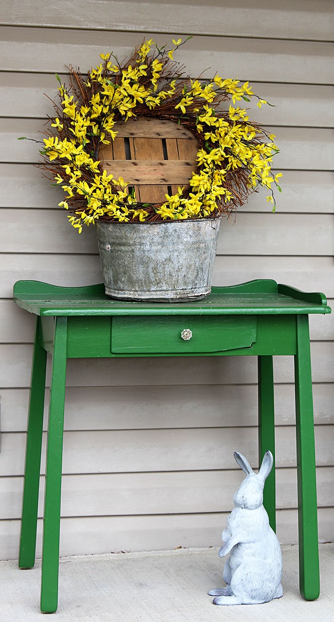 A simple and easy farmhouse spring porch decor idea made with things found in the shed. Truly spring decorating on a budget! #spring #porch #frontporch