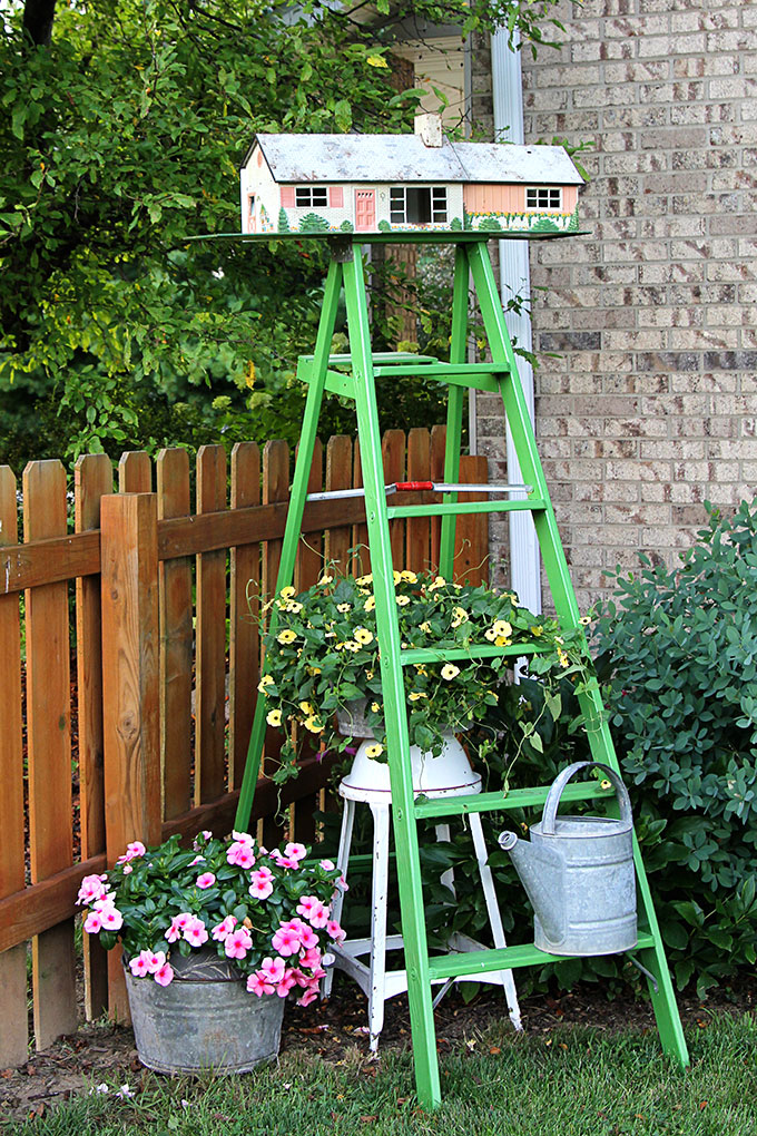 Turn a vintage tin dollhouse into a birdhouse