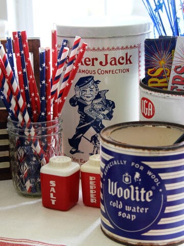 A patriotic vignette with a mix of red white and blue vintage items for the 4th of July
