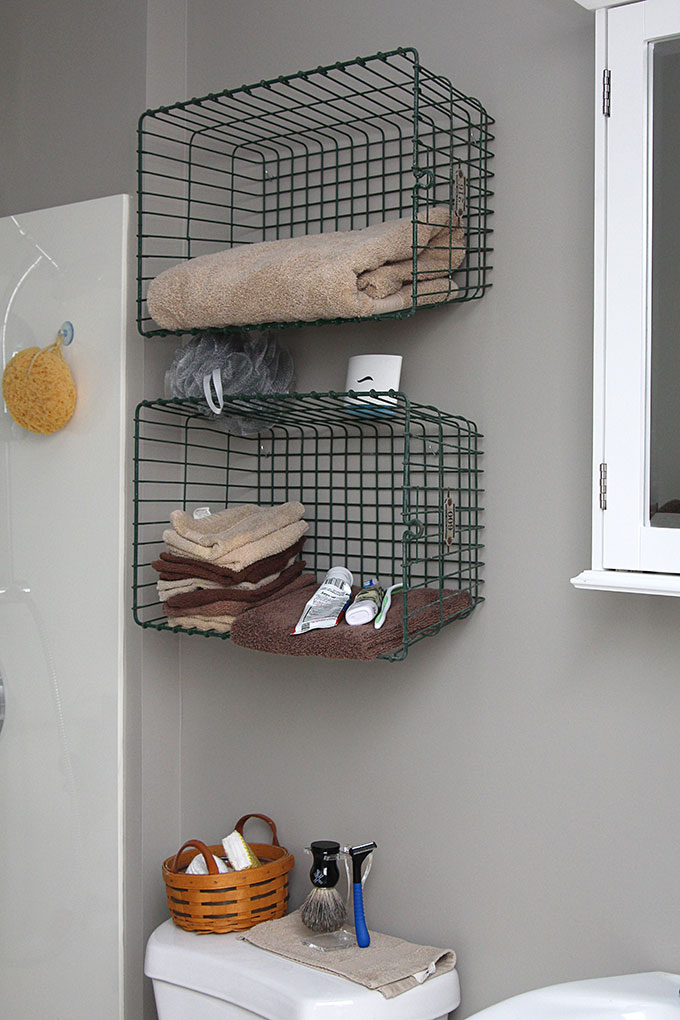 Bathroom with locker baskets as shelves