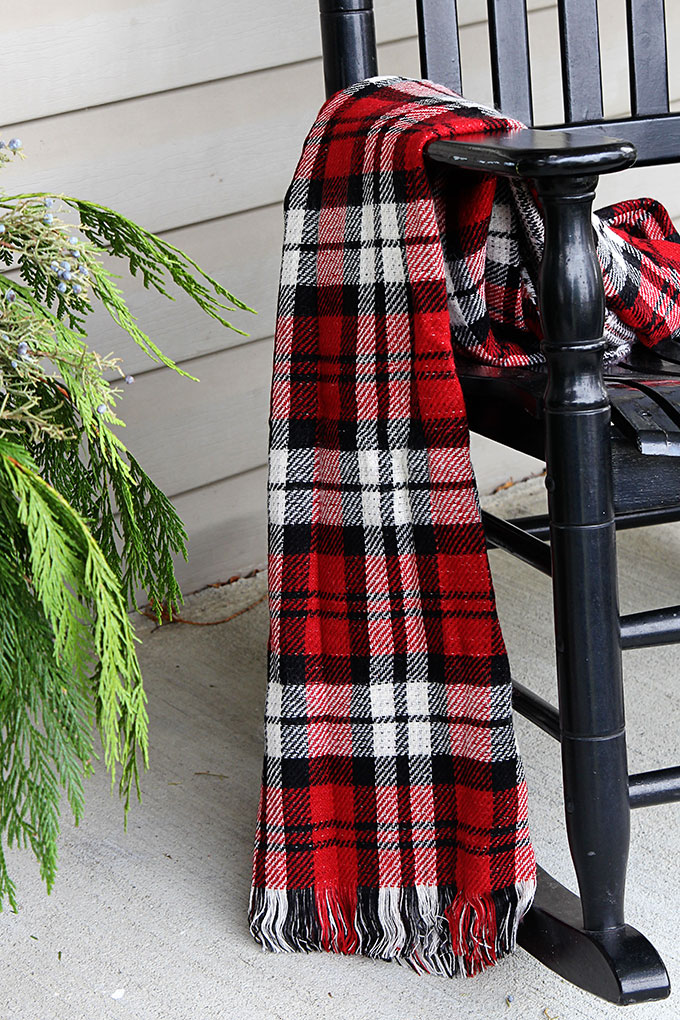 Festive Christmas porch decorations that transition easily from Christmas to winter are found on our rustic, farmhouse, plaid and nature inspired porch.