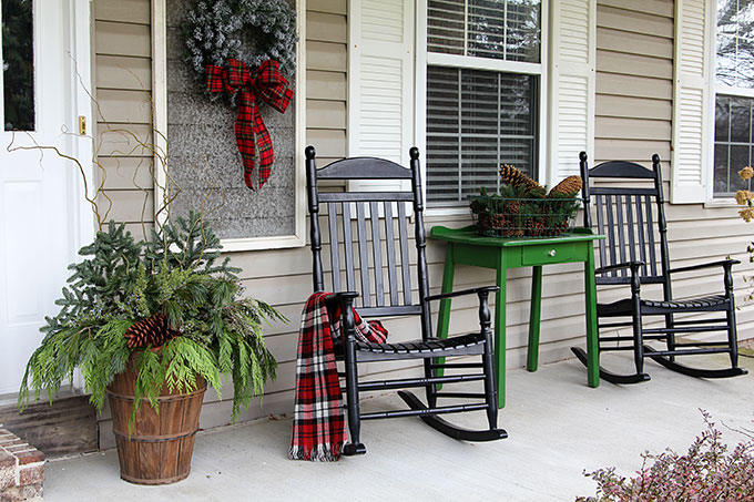 Festive Christmas porch decorations that transition easily from Christmas to winter are found on our rustic, farmhouse, plaid and nature inspired porch.