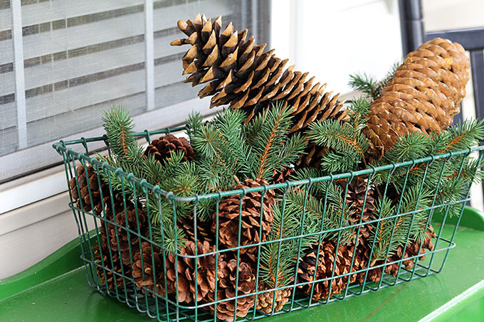 Festive Christmas porch decorations that transition easily from Christmas to winter are found on our rustic, farmhouse, plaid and nature inspired porch.