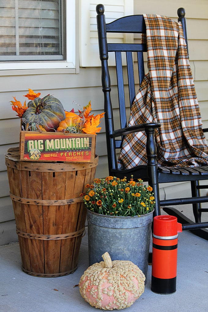 Fall on the porch with bushel baskets and rocking chairs