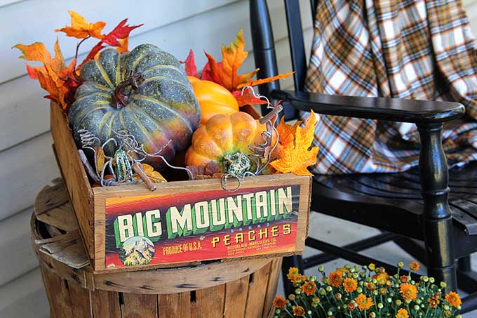 Vintage Big Mountain peach crate filled with pumpkins for fall decor