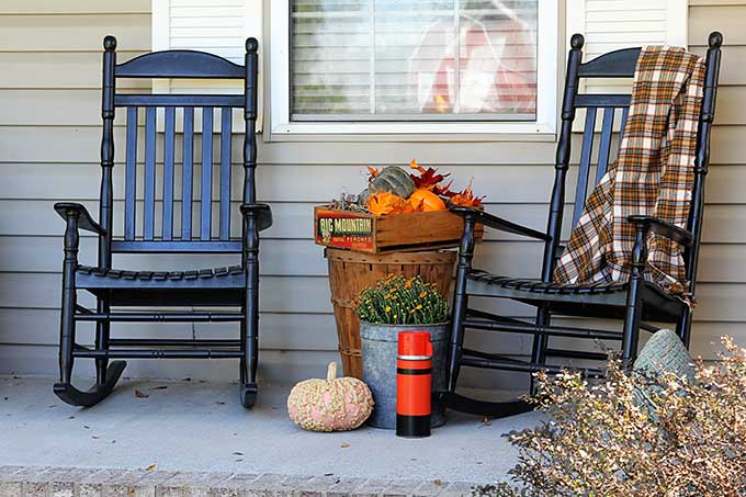 Black rocking chairs on the fall porch