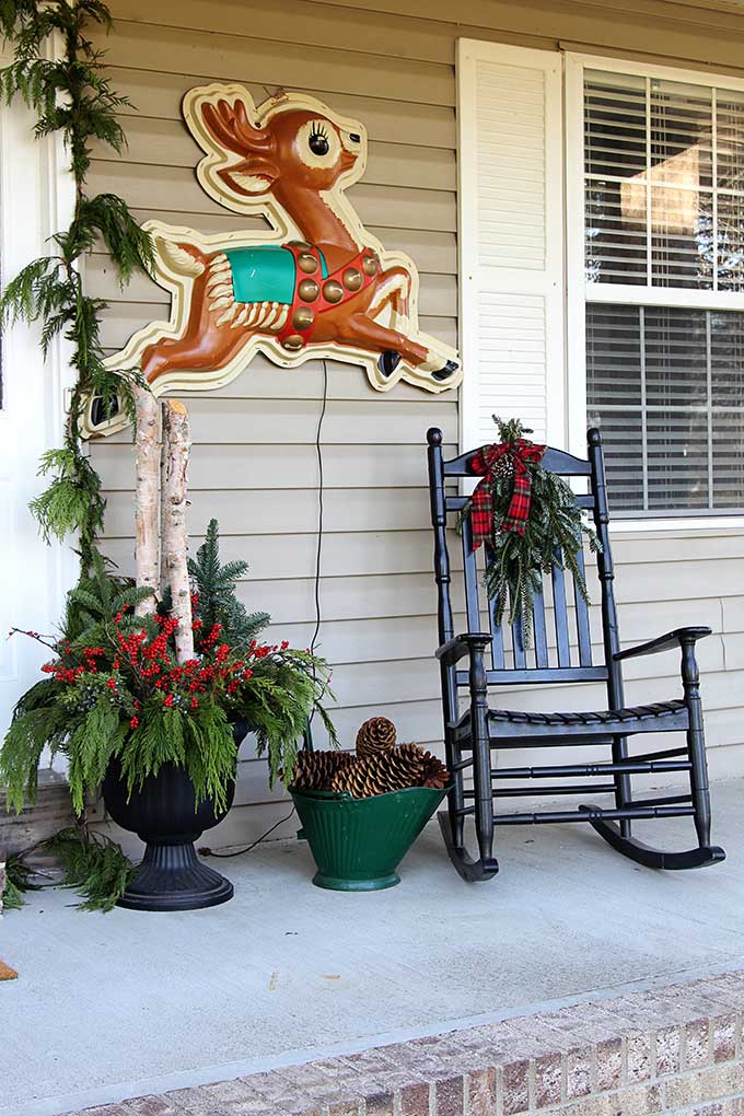 Retro store display reindeer used as holiday porch decor