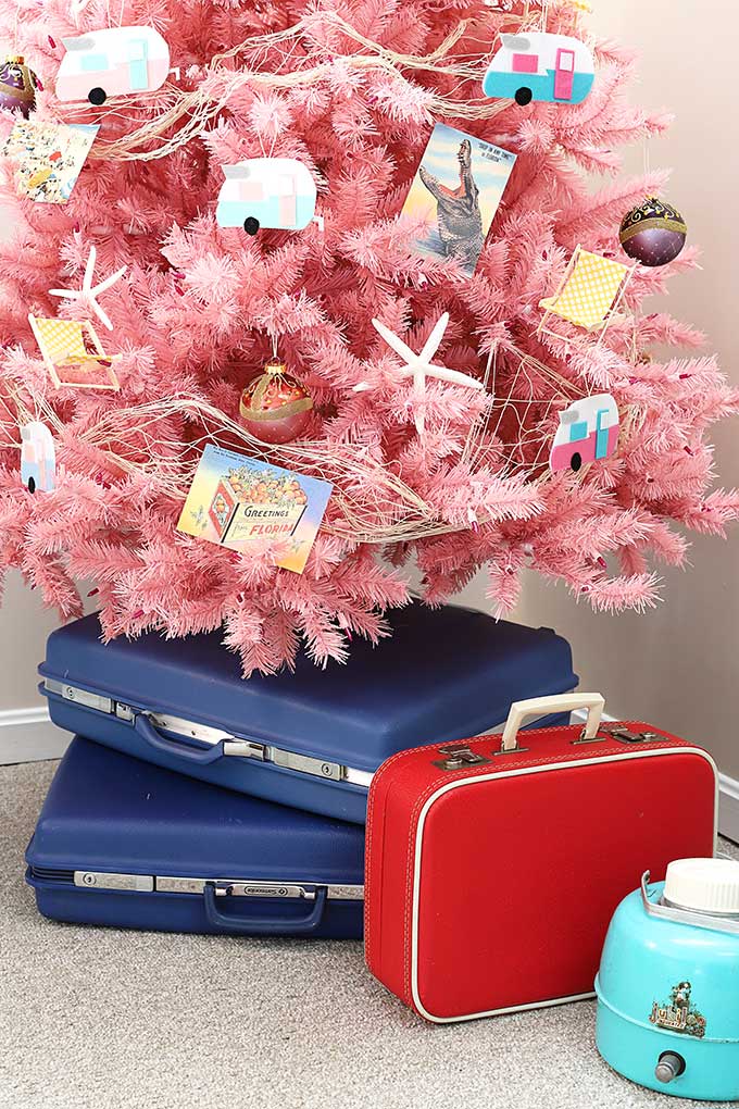 Vintage suitcases used as a unique Christmas tree stand