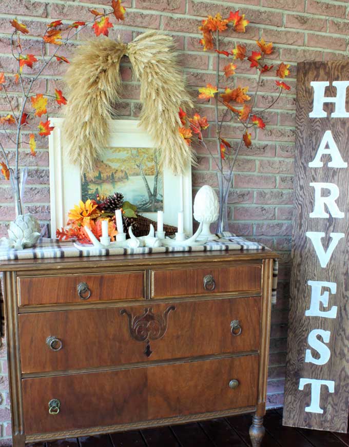 Dresser used as front porch decor for fall from A Purdy Little House