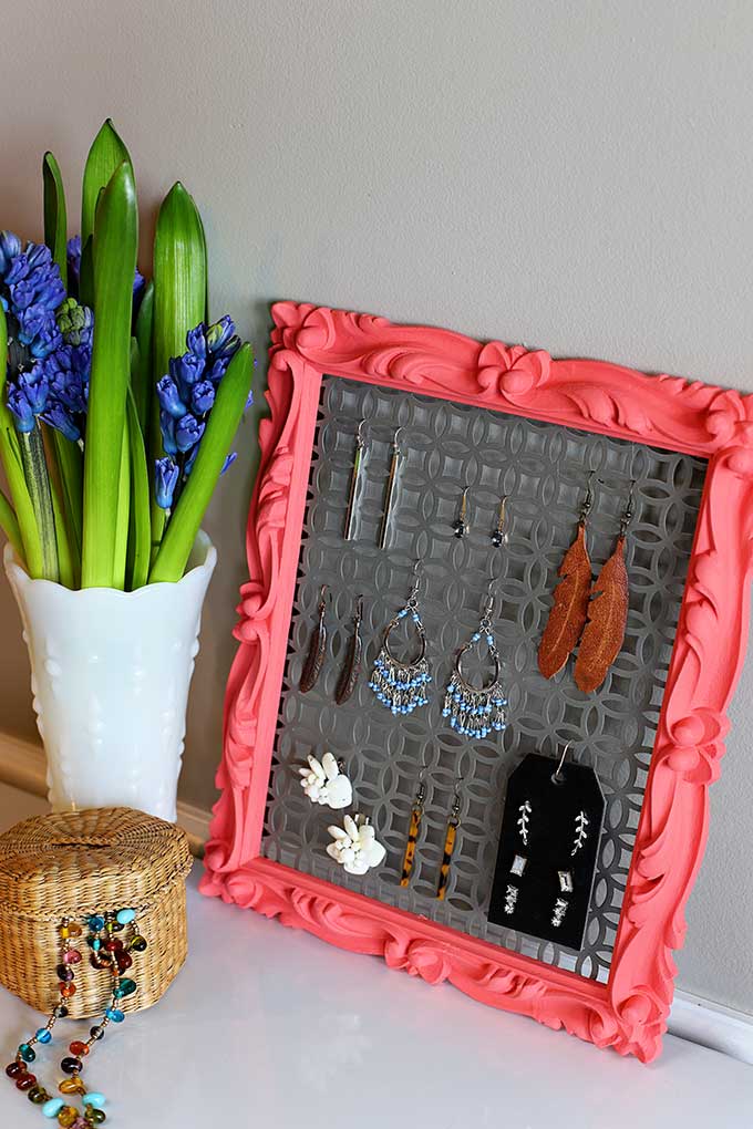 Quick and Easy DIY earring holder out of aluminum sheet from hardware store and a thrift store frame. A great repurposing project for both hoops and studs!