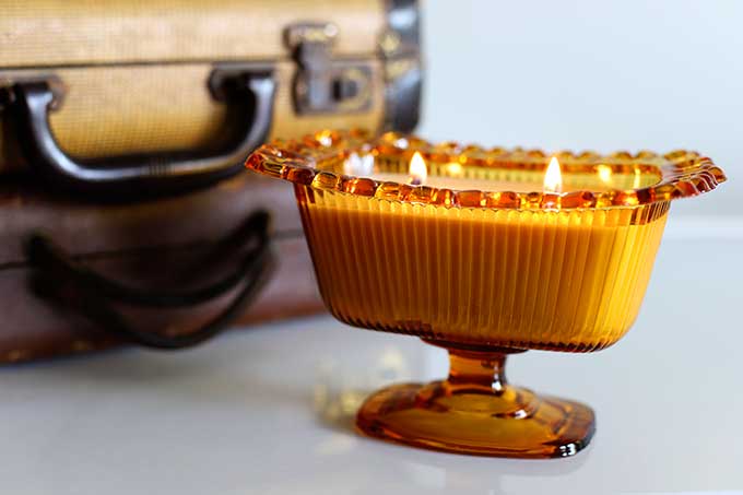 Lighting DIY candles made in thrift store candy dishes