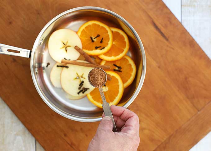 Adding nutmeg to simmering potpourri