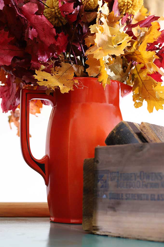 Vintage orange and black pitcher