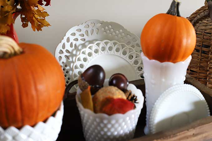 Vintage fall vignette using white milkglass