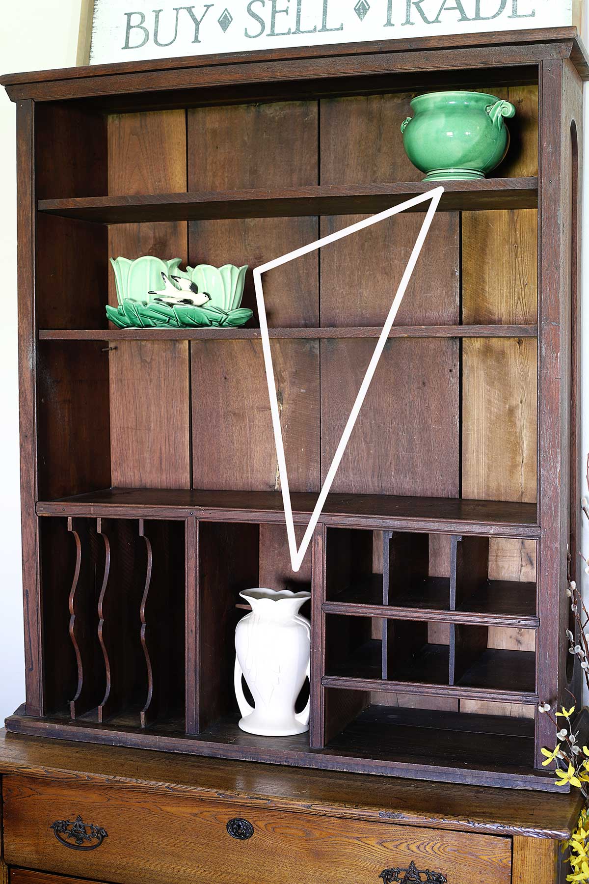 arranging bookshelf decor in a triangle