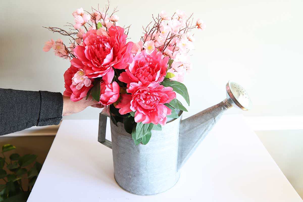 flowers in watering can