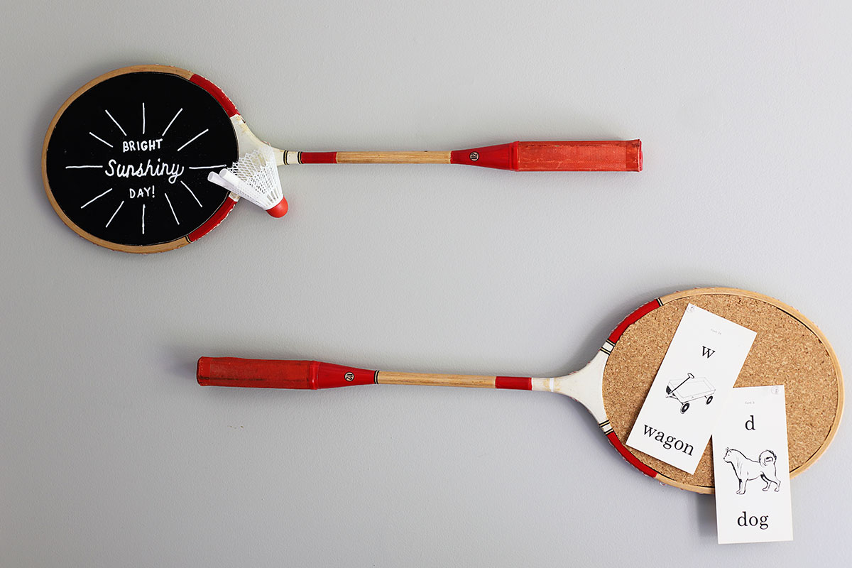 badminton racket repurposed as chalkboard and bulletin board