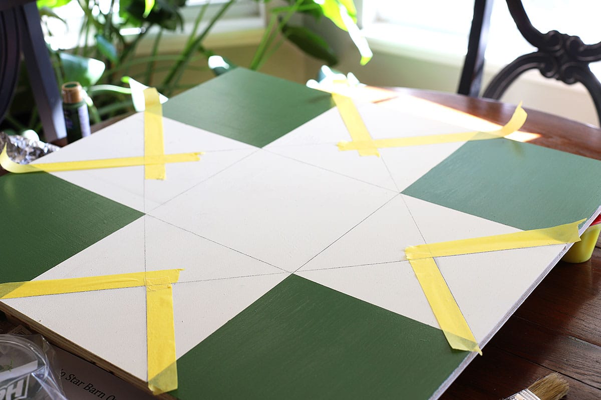 painting Ohio star barn quilt