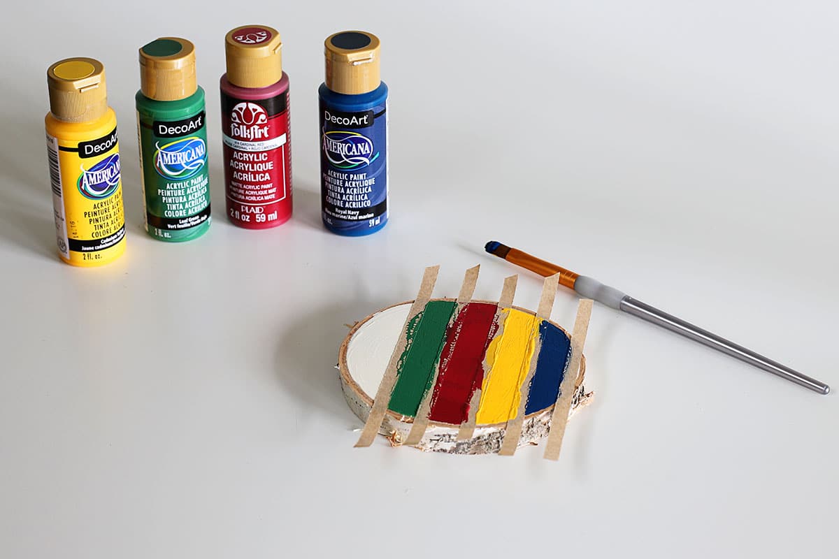 painting stripes on wood slice coasters